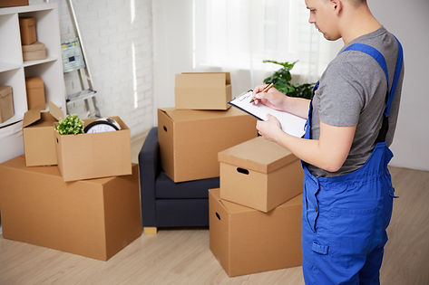 Mover checking boxes on moving day